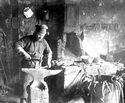 Blacksmith in shop